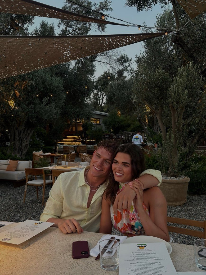 At a restaurant table with a friend